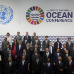 
              United Nations Secretary-General Antonio Guterres, Portuguese President Marcelo Rebelo de Sousa, and Kenya President Uhuru Kenyatta, center of front row, take part in a group photo at the United Nations Ocean Conference in Lisbon, Monday, June 27, 2022. From June 27 to July 1, the United Nations is holding its Oceans Conference in Lisbon expecting to bring fresh momentum for efforts to find an international agreement on protecting the world's oceans. (AP Photo/Armando Franca)
            