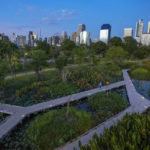 
              Peoples walk on a path running through a wetland part at Benjakitti Park in Bangkok, Thailand, Friday, April 1, 2022. Bursting with trees, ponds, plants and birdlife, the new inner-city park is delighting residents of Thailand’s bustling, congested capital. Every day, crowds visit Benjakitti Forest Park to savor a taste of nature in the heart of Bangkok. (AP Photo/Sakchai Lalit)
            