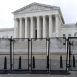 
              Anti-scaling fencing is seen outside the Supreme Court, Thursday, June 23, 2022, in Washington. (AP Photo/Jacquelyn Martin)
            