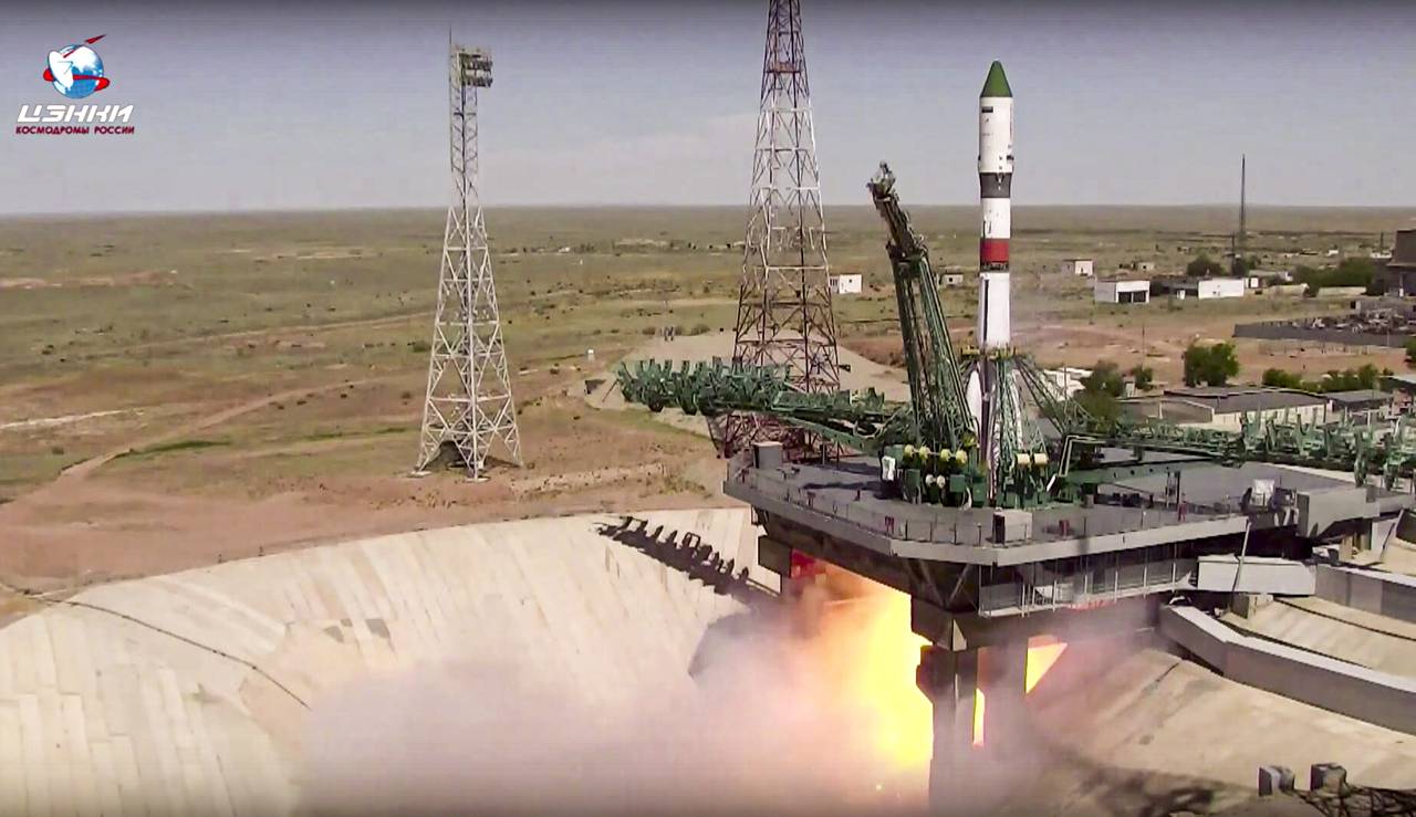 In this photo taken from video released by the Roscosmos Space Agency, the Soyuz-2.1a rocket booste...