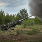 
              Ukrainian soldiers fire at Russian positions from a U.S.-supplied M777 howitzer in Ukraine's eastern Donetsk region Saturday, June 18, 2022. (AP Photo/Efrem Lukatsky)
            