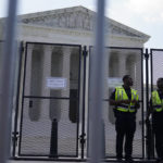 
              Members of the U.S. Capitol Police stand by security fencing surround the U.S. Supreme Court in Washington, Monday, June 13, 2022. (AP Photo/Mariam Zuhaib)
            