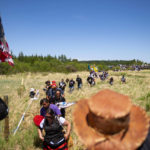 
              FILE - Indigenous leaders and "water protectors" march through swamp land to the boardwalk leading to an Enbridge pipeline construction site, June 7, 2021, in Clearwater County, Minn. The Biden administration on Thursday, June 2, 2022, proposed undoing a Trump-era rule that limited the power of states and Native American tribes to block energy projects like natural gas pipelines based on their potential to pollute rivers and streams. (Alex Kormann/Star Tribune via AP, File)
            