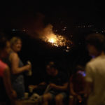 
              Trees burn as flames and smoke engulf the top of a hill in a forest fire in Artazu, northern Spain in the early hours of Sunday, June 19, 2022. Firefighters in Spain are struggling to contain wildfires in several parts of the country suffering an unusual heat wave for this time of the year. (AP Photo/Miguel Oses)
            