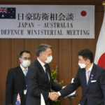 
              Australian Deputy Prime Minister and Defense Minister Richard Marles, left, and Japanese Defense Minister Nobuo Kishi shake hands after a joint news conference at the Ministry of Defense on Wednesday, June 15, 2022, in Tokyo. (AP Photo/Shuji Kajiyama, Pool)
            
