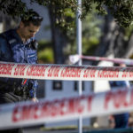 
              Police set up a cordon and search area in a suburb of Auckland following reports of multiple stabbings, in New Zealand, Thursday, June 23, 2022. Authorities say a man wounded some people in a stabbing rampage in a New Zealand city before bystanders brought him to the ground. (Michael Craig/New Zealand Herald via AP)
            