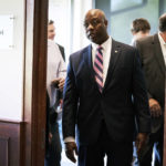 
              Sen. Tim Scott, R-S.C.,enters an Iowa GOP reception, Thursday, June 9, 2022, in Cedar Rapids, Iowa. At least a half dozen GOP presidential prospects are planning Iowa visits this summer, forays that are advertised as promoting candidates and the state Republican organization ahead of the fall midterm elections. But in reality, the trips are about building relationships and learning the political geography in the state scheduled to launch the campaign for the party's 2024 nomination. (AP Photo/Charlie Neibergall)
            