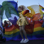 
              A drag queen dances during the annual Pride Parade in Jerusalem, Thursday, June 2, 2022. Thousands of people marched through the streets of Jerusalem on Thursday in the parade under heavy security over fears of extremism. (AP Photo/Ariel Schalit)
            