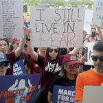 
              Stephanie Horowitz, 19, a recent graduate of Marjory Stoneman Douglas High School holds up a sign during the March For Our Lives Parkland to Demand an End to Gun Violence rally at Pine Trails Park Amphitheater in Parkland, Fla., on Saturday, June 11, 2022. The rally and march coordinated with over 400 marches nationwide. (Mike Stocker/South Florida Sun-Sentinel via AP)
            