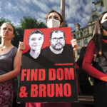 
              People take part in a vigil outside the Brazilian Embassy for Dom Phillips and Bruno Araujo Pereira, a British journalist and an Indigenous affairs official who are missing in the Amazon, in London, Thursday, June 9, 2022. Brazilian authorities began using helicopters Wednesday to search a remote area of the Amazon rainforest for a British journalist and Indigenous official missing more than three days. (Victoria Jones/PA via AP)
            