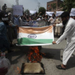 
              Pakistani people burn a representation of Indian flag during a demonstration to condemn derogatory references to Islam and the Prophet Muhammad recently made by Nupur Sharma, a spokesperson of the governing Indian Hindu nationalist party, Friday, June 10, 2022, in Peshawar, Pakistan. (AP Photo/Mohammad Sajjad)
            