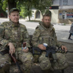 
              Ukrainian soldiers enjoy a short rest in Bakhmut, Donetsk region, Ukraine, Sunday, June 26, 2022. (AP Photo/Efrem Lukatsky)
            
