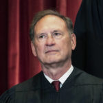 
              FILE - Associate Justice Samuel Alito sits during a group photo at the Supreme Court in Washington, April 23, 2021. The Supreme Court has ended constitutional protections for abortion that had been in place nearly 50 years — a decision by its conservative majority to overturn the court's landmark abortion cases. (Erin Schaff/The New York Times via AP, Pool, File)
            