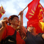 
              Supporters of the opposition VMRO-DPMNE party chant and wave national flags in front of the government building in Skopje, North Macedonia, on Saturday, June 18, 2022. Thousands of opposition supporters have gathered late on Saturday for an anti-government protest in downtown of North Macedonia's capital Skopje in a bid to press leftist government on snap elections, two years earlier of regular term. (AP Photo/Boris Grdanoski)
            