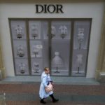 
              A visitor walks inside the GUM department store with a Dior boutique closed due to sanctions in Moscow, Russia, Tuesday, May 31, 2022. Many Western retailers have left Russia after the start of a military action in Ukraine. (AP Photo/Alexander Zemlianichenko)
            