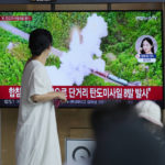 
              People watch a TV screen showing a news program reporting about North Korea's missile launch with file footage, at a train station in Seoul, South Korea, Sunday, June 5, 2022. North Korea test-fired a salvo of multiple short-range ballistic missiles toward the sea on Sunday, South Korea's military said, extending a provocative streak in weapons demonstrations this year that U.S. and South Korean officials say may culminate with a nuclear test explosion. (AP Photo/Lee Jin-man)
            