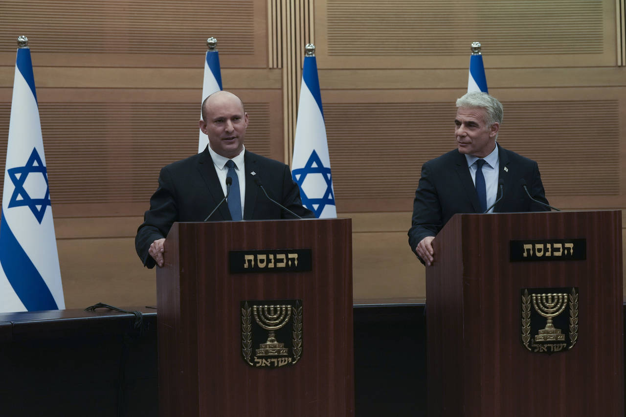 Israeli Prime Minister Naftali Bennett, left, speaks during a joint statement with Foreign Minister...