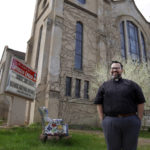 
              The Rev. Hierald Osorto stands in front of St. Paul Lutheran Church in Minneapolis on Thursday, May 12, 2022. Osorto, whose parish is near the Abubakar As-Saddique Islamic Center, does not anticipate pushback from his congregants on the public broadcasting of the Islamic call to prayer. (AP Photo/Jessie Wardarski)
            