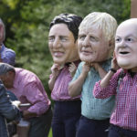 
              Activists from Oxfam wear giant heads depicting G7 leaders during a demonstration in Munich, Germany, Saturday, June 25, 2022. The G7 Summit will take place at Castle Elmau near Garmisch-Partenkirchen from June 26 through June 28, 2022. Leaders depicted from left, U.S. President Joe Biden, Canada's Prime Minister Justin Trudeau, British Prime Minister Boris Johnson and German Chancellor Olaf Scholz. (AP Photo/Matthias Schrader)
            