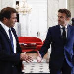 
              French President Emmanuel Macron, right, shakes hands with Christian Jacob, head of Les Republicains party (The Republicans or LR), after their meeting at the Elysee Palace in Paris, France, Tuesday, June 21, 2022. French President Emmanuel Macron was holding talks Tuesday with France's main party leaders after his centrist alliance failed to win an absolute majority in parliamentary elections. (Mohammed Badra/Pool photo via AP)
            