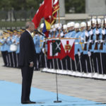 
              Turkish President Recep Tayyip Erdogan salutes a military honour guard during an official welcome ceremony, in Ankara, Turkey, Wednesday, June 8, 2022. Erdogan on Thursday warned Greece to demilitarize islands in the Aegean, saying he was "not joking" with such comments. Turkey says Greece has been building a military presence on Aegean in violation of treaties that guarantee the unarmed statues of the islands. (AP Photo/Burhan Ozbilici)
            