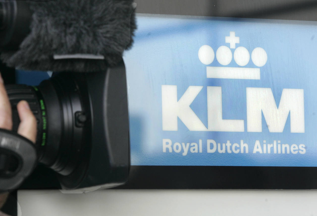 FILE - A cameraman films the Logo of Dutch airline KLM at the Cologne Bonn Airport in Cologne, west...