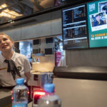 
              A staff member speaks with visitors at a newly opened fast food restaurant in a former McDonald's outlet in Bolshaya Bronnaya Street in Moscow, Russia, Sunday, June 12, 2022. The first of former McDonald's restaurants is reopened with new branding in Moscow. The corporation sold its branches in Russia to one of its local licensees after Russia sent tens of thousands of troops into Ukraine. (AP Photo/Dmitry Serebryakov)
            