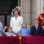 
              Queen Elizabeth II, from left, Prince Louis, Kate, Duchess of Cambridge, Princess Charlotte, Prince George and Prince William stand on the balcony of Buckingham Palace, London, Thursday June 2, 2022, on the first of four days of celebrations to mark the Platinum Jubilee. The events over a long holiday weekend in the U.K. are meant to celebrate the monarch's 70 years of service. (Alastair Grant/Pool Photo via AP)
            