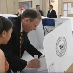 
              Republican candidate for governor and U.S. Rep. Lee Zeldin casts his vote for governor at the Mastic Beach firehouse on Tuesday, June. 28, 2022 in Mastic Beach, N.Y.  New Yorkers are casting votes in a governor’s race Tuesday that for the first time in a decade does not include the name “Cuomo” at the top of the ticket. (James Carbone/Newsday via AP)
            