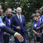 
              President Joe Biden talks to riders at the White House in Washington, Thursday, June 23, 2022, during an event to welcome wounded warriors, their caregivers and families to the White House as part of the annual Soldier Ride to recognize the service, sacrifice, and recovery journey for wounded, ill, and injured service members and veterans. (AP Photo/Susan Walsh)
            