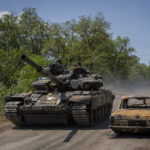 
              Ukrainian servicemen drive a tank near the frontline in Donetsk region, eastern Ukraine, Monday, June 6, 2022. (AP Photo/Bernat Armangue)
            