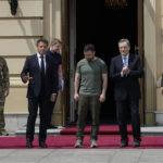 
              From left, German Chancellor Olaf Scholz, French President Emmanuel Macron, Ukrainian President Volodymyr Zelenskyy, Italian Prime Minister Mario Draghi and Romanian President Klaus Iohannis pose for a picture at the Mariyinsky Palace in Kyiv, Ukraine, Thursday, June 16, 2022.  Four European leaders, of France, Italy, Germany and Romania, made a high-profile visit to Ukraine, where they were saw the ruins of a Kyiv suburb on Thursday and denounced the brutality of a Russian invasion that has killed many civilians. (AP Photo/Natacha Pisarenko)
            