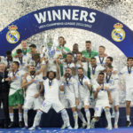 
              Real Madrid's Marcelo lifts the trophy after winning the Champions League final soccer match between Liverpool and Real Madrid at the Stade de France in Saint Denis near Paris, Saturday, May 28, 2022. Real Madrid defeated Liverpool 1-0.(AP Photo/Manu Fernandez)
            