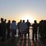 
              World War II reenactors gather on Omaha Beach during a D-Day commemoration ceremony of the 78th anniversary for those who helped end World War II, in Saint-Laurent-sur-Mer, Normandy, France, Monday, June 6, 2022. (AP Photo/Jeremias Gonzalez)
            