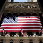 
              The American flag is shown at the New York Stock Exchange on Wednesday, June 29, 2022 in New York.  Stocks shifted between gains and losses on Wall Street Wednesday, keeping the market on track for its fourth monthly loss this year.   (AP Photo/Julia Nikhinson)
            