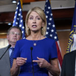 
              Rep. Mary Miller, R-Ill., flanked by Rep. Thomas Massie, R-Ky., left, and Rep. Andrew Clyde, R-Ga., speaks as Republican members of the House Second Amendment Caucus talk to reporters as they criticize a series of Democratic measure to curb gun violence in the wake of the mass shootings at a school in Uvalde, Texas, and a grocery in Buffalo, N.Y., at the Capitol in Washington, Wednesday, June 8, 2022. (AP Photo/J. Scott Applewhite)
            