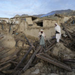 
              Afghans stand among destruction after an earthquake in Gayan village, in Paktika province, Afghanistan, Thursday, June 23, 2022. A powerful earthquake struck a rugged, mountainous region of eastern Afghanistan early Wednesday, flattening stone and mud-brick homes in the country's deadliest quake in two decades, the state-run news agency reported. (AP Photo/Ebrahim Nooroozi)
            