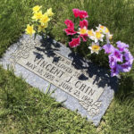 
              Vincent Chin’s headstone at Forest Lawn Cemetery, on May 9, 2022, in Detroit. Detroit is helping to honor Chin, a Chinese American man who was beaten to death 40 years ago by two white men who never served jail time. The commemoration comes as hate crimes against Asian Americans are on the rise in the U.S. The Vincent Chin 40th Remembrance & Rededication begins Thursday, June 16, and focuses on civil rights efforts that started with his 1982 death. (AP Photo/Corey Williams)
            