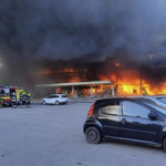 
              In this image made from video provided by Ukrainian State Emergency Service, firefighters work to extinguish a fire at a shopping center burned after a rocket attack in Kremenchuk, Ukraine, Monday, June 27, 2022. (Ukrainian State Emergency Service via AP)
            