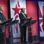 
              Former Westchester County Executive Rob Astorino, far left, businessman Harry Wilson, second from left, Suffolk County Congressman Lee Zeldin, second from right, and Andrew Giuliani, far right, son of former New York City Mayor Rudy Giuliani, face off during New York's Republican gubernatorial debate at the studios of CBS2 TV, Monday, June 13, 2022, in New York. Giuliani participated via virtual broadcast after he was blocked from the studios for not meeting vaccine requirements. (AP Photo/Bebeto Matthews)
            