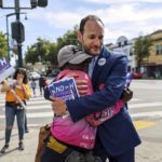 
              District Attorney Chesa Boudin embraces supporter Dayday Reynolds Priestly as he canvasses on 3rd Street in the Bayview neighborhood ahead of the recall on Tuesday, June 7, 2022, in San Francisco. (Gabrielle Lurie/San Francisco Chronicle via AP)
            