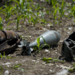 
              Unexploded shells and other weaponry is displayed by a Ukrainian specialized team searching for them in a field on the outskirts of Kyiv, Ukraine, Thursday, June 9, 2022. (AP Photo/Natacha Pisarenko)
            