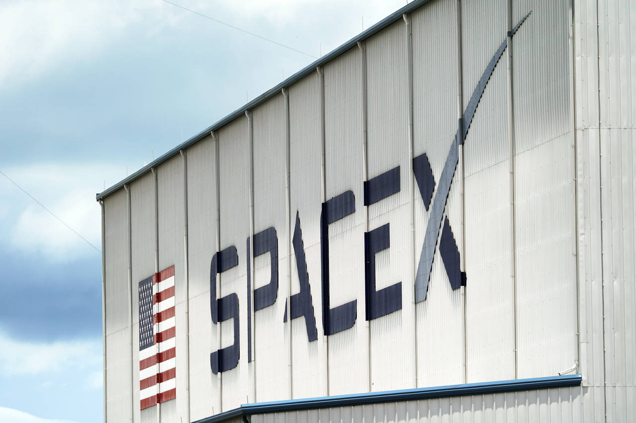 FILE - a SpaceX logo is displayed on a building on May 26, 2020, at the Kennedy Space Center in Cap...