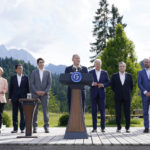 
              German Chancellor Olaf Scholz with from left, Ursula von der Leyen, President of the European Commission, Fumio Kishida, Prime Minister of Japan, Justin Trudeau, Prime Minister of Canada, U.S. President Joe Biden, Mario Draghi, Prime Minister of Italy and Charles Michel, President of the European Council, speaks and formally launches the global infrastructure partnership on the margins of the G7 Summit in Elmau, Germany, Sunday, June 26, 2022. (AP Photo/Susan Walsh)
            