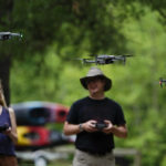
              CORRECTS LAST NAME TO LIVELY FROM LIZELY - Quincey Johnson, left, outreach director Upper Missouri Waterkeeper in Bozeman, Mont., and Martin Lively, Grand Riverkeeper with LEAD Agency in Miami, Okla., fly their drones during a training session, Tuesday, June 7, 2022, in Poolesville, Md. They work to protect rivers and waterways and are training to use drones to catch polluters in places where wrongdoing is difficult to see or expensive to find. The Waterkeeper alliance has already used drone images to formally accuse companies of wrongdoing. (AP Photo/Julio Cortez)
            