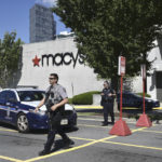 
              Police stand outside a Macys department store at Tysons Corner Mall in Tysons Corner, Va., on Saturday, June 18, 2022. A gun was fired when a fight broke out at a northern Virginia mall on Saturday, but no injuries were reported and there was no active shooter situation, police said. (Craig Hudson/The Washington Post via AP)
            