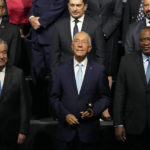 
              From left, United Nations Secretary-General Antonio Guterres, Portuguese President Marcelo Rebelo de Sousa, and Kenyan President Uhuru Kenyatta take part in a group photo at the United Nations Ocean Conference in Lisbon, Monday, June 27, 2022. From June 27 to July 1, the United Nations is holding its Oceans Conference in Lisbon expecting to bring fresh momentum for efforts to find an international agreement on protecting the world's oceans. (AP Photo/Armando Franca)
            