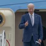 
              President Joe Biden gestures as he boards Air Force One at Andrews Air Force Base, Md., Tuesday, June 14, 2022. Biden is traveling to Philadelphia to speak at the AFL-CIO convention on how he's trying to make the economy work for working-class Americans. (AP Photo/Gemunu Amarasinghe)
            
