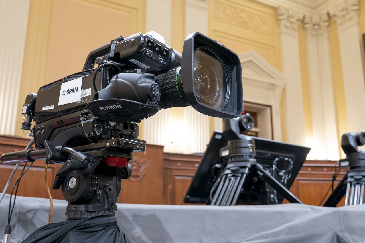 FILE - Television crews and technicians prepare the Cannon Caucus Room for Thursday night's hearing...