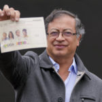 
              Gustavo Petro, presidential candidate with the Historical Pact coalition, shows his ballot before voting in a presidential runoff in Bogota, Colombia, Sunday, June 19, 2022. (AP Photo/Fernando Vergara)
            
